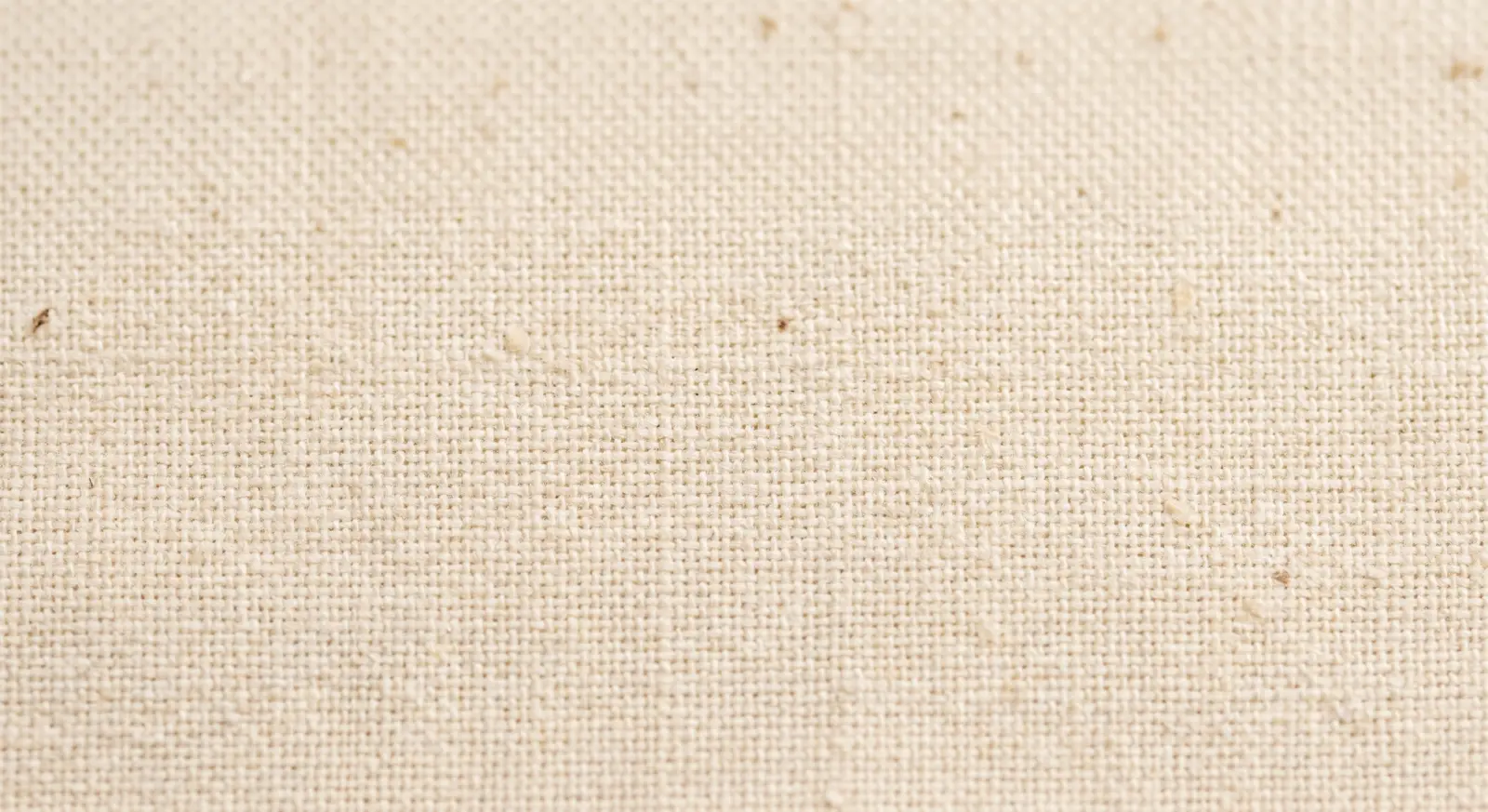 Close-up detail of an unbleached natural cotton weave